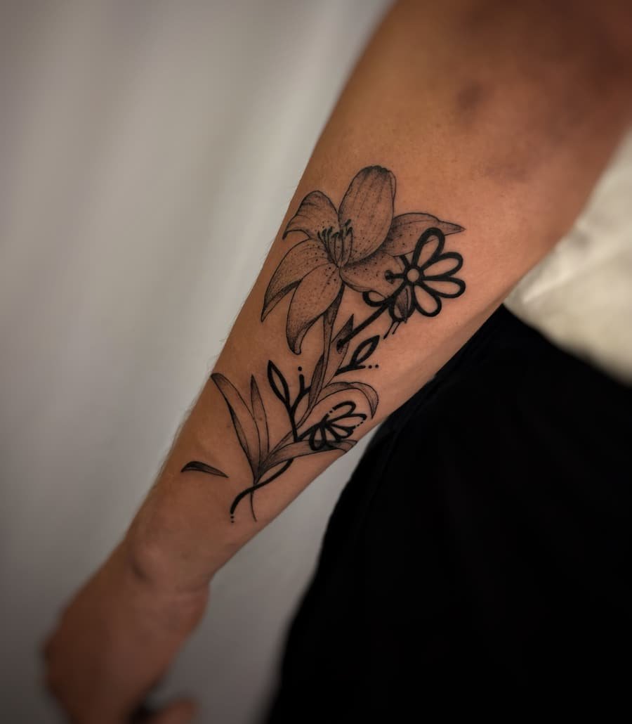 Fine line floral tattoo on forearm by Paride